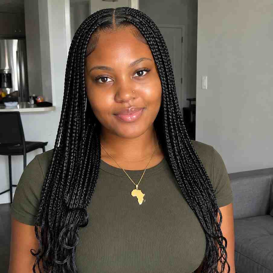 Fulani Braids for Round Face Shapes: The Styles That Flatter Most Center-part Fulani braids on a round face showing long braid lengths past the shoulders