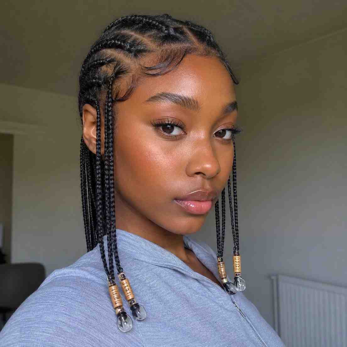 Fulani Braids With Accessories Placed At Braid Ends Rather Than At Ear Level